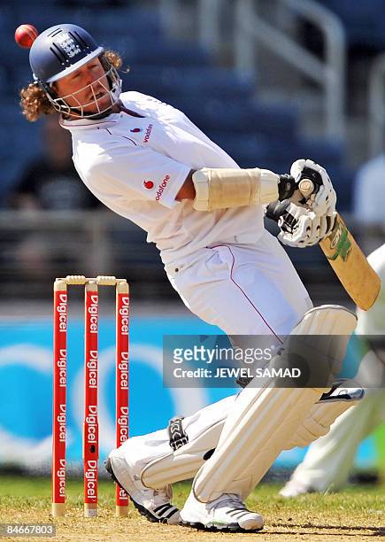 England's cricketer Ryan Sidebottom avoids a bouncer off West Indies bowler Jermoe Taylor during the second day of the first Test match between...