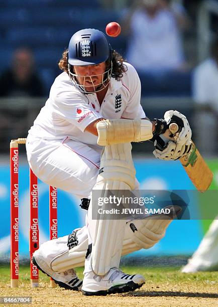 England's cricketer Ryan Sidebottom avoids a bouncer off West Indies bowler Jermoe Taylor during the second day of the first Test match between...