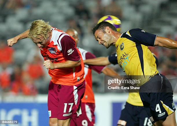 Mitchell Nichols of the Roar heads the ball past Pedj Bojic of the Mariners to score during the A-League minor semi final first leg match between the...