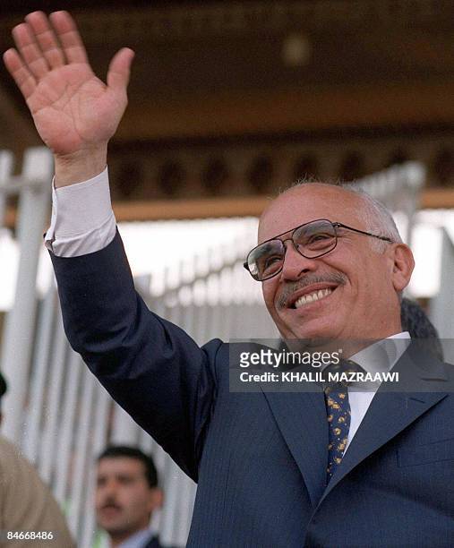 -- An undated file picture shows Jordan's King Hussein waving to crowds in Amman. Ten years after the death of the late Jordanian monarch on February...