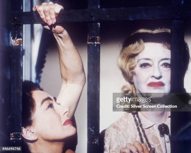 American actresses Joan Crawford as Blanche Hudson and Bette Davis as Jane Hudson, in the thriller/horror movie 'What Ever Happened to Baby Jane?',...