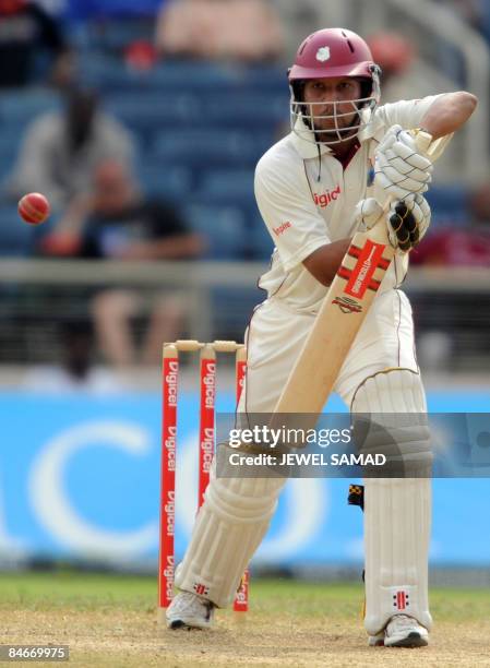 West Indies cricketer Ramnaresh Sarwan hits the ball off England's bowler Stuart Broad during the second day of the first Test match between England...