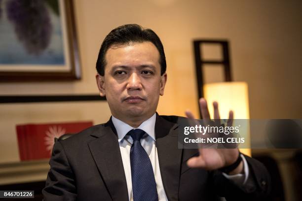 This photo taken on September 13, 2017 shows Philippine Senator Antonio gesturing during an interview at his office in the Senate building in Manila....