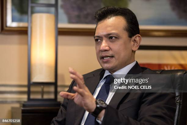 This photo taken on September 13, 2017 shows Philippine Senator Antonio gesturing during an interview at his office in the Senate building in Manila....