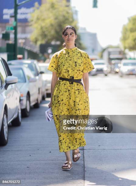 Caroline Issa wearing yellow dress seen in the streets of Manhattan outside Delpozo during New York Fashion Week on September 13, 2017 in New York...