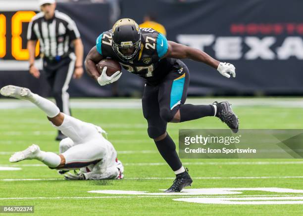 Jacksonville Jaguars running back Leonard Fournette carries the ball during the NFL game between the Jacksonville Jaguars and Houston Texans on...