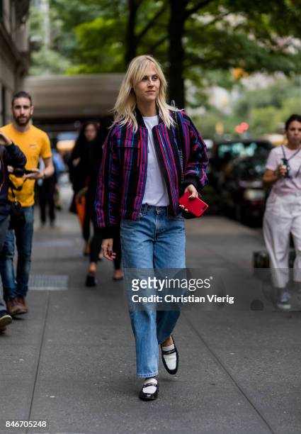 Linda Tol wearing striped jacket, denim jeans seen in the streets of Manhattan outside Marc Jacobs during New York Fashion Week on September 13, 2017...