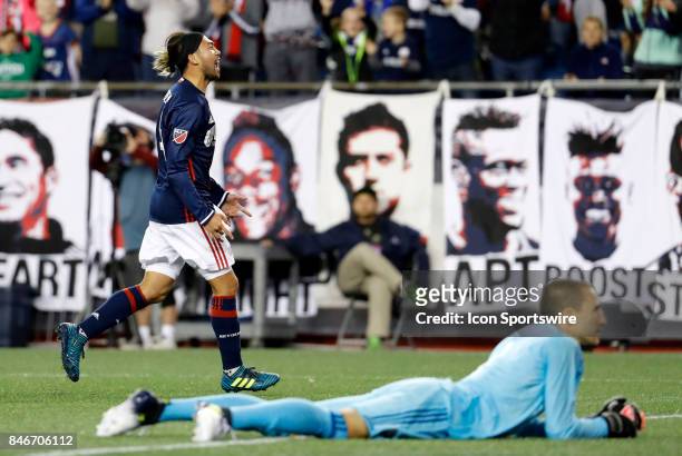 New England Revolution midfielder Lee Nguyen celebrates as Montreal Impact goalkeeper Evan Bush reacts to the goal during an MLS match between the...