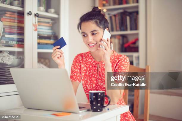 working at home - young woman trolley stock pictures, royalty-free photos & images