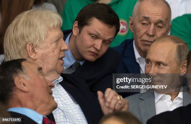 Russian President Vladimir Putin speaks with former Canadian hockey players Pete Mahovlich and Pat Stapleton , participants of the legendary 1972...