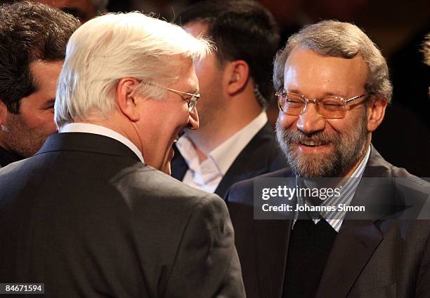 Iran's parliament speaker Ali Larijani is welcomed by German Vice Chancellor Frank-Walter Steinmeier during the first day of the Munich conference on...