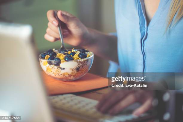 having breakfast - telecommuting eating stock pictures, royalty-free photos & images