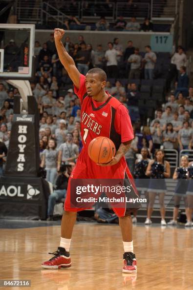 Corey Chandler of the Rutgers Scarlet Knights calls a play during a ...