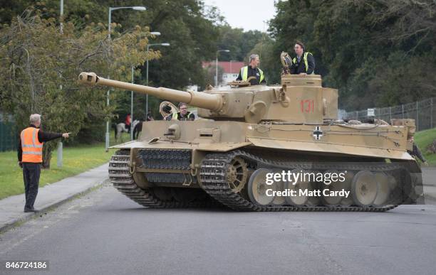 Staff and volunteers help move a German Tiger Tank, the only working example in the world, at the Bovington Tank Museum ahead of this weekend's Tiger...