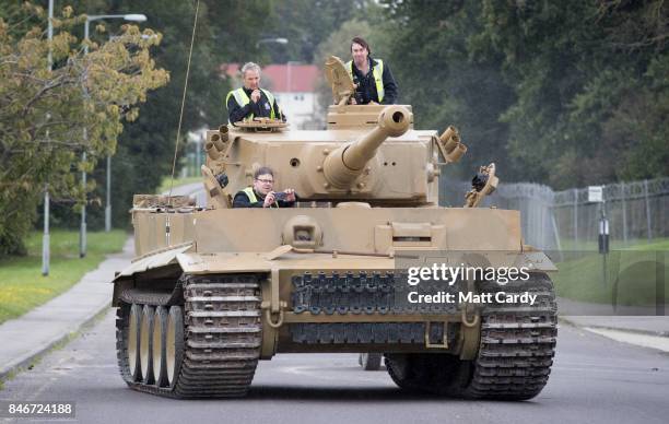 Staff and volunteers help move a German Tiger Tank, the only working example in the world, at the Bovington Tank Museum ahead of this weekend's Tiger...