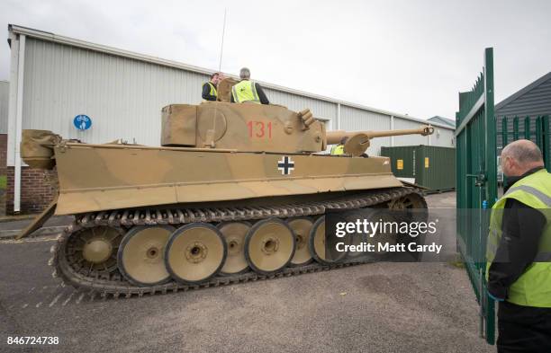 Staff and volunteers help move a German Tiger Tank, the only working example in the world, at the Bovington Tank Museum ahead of this weekend's Tiger...