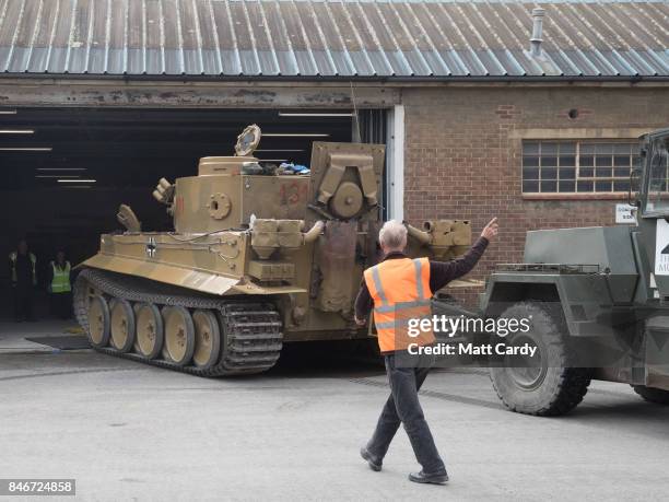 Staff and volunteers help move a German Tiger Tank, the only working example in the world, at the Bovington Tank Museum ahead of this weekend's Tiger...