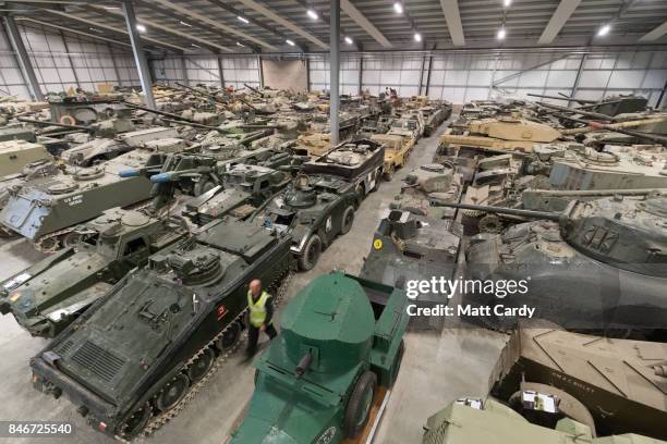 Staff and volunteers help prepare tanks stored at the Vehicle Conservation Centre at the Bovington Tank Museum for this weekend's Tiger Day, which...