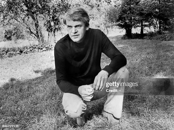 Czech writer Milan Kundera poses in a garden in Prague 14 October 1973. Novelist born in Brno, Czech Republic, Kundera lectured in Cinematographic...