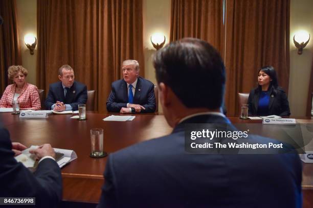 Donald J. Trump, C, meets with a bipartisan group of House members - including, from L-R, Rep. Susan Brooks , Rep. Josh Gottheimer , Rep. Thomas...