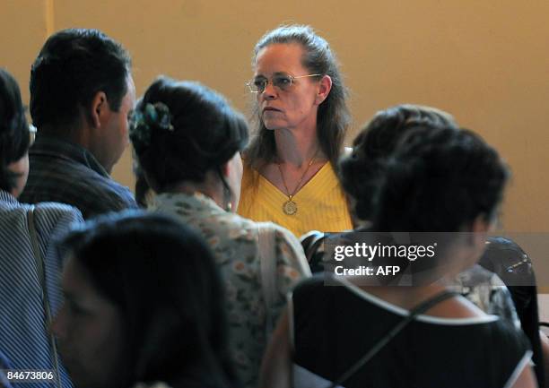Judge Sylvie Gagnard , of the financial section of Paris court, listens to the vicitms of a fraud during a hearing in Coltauco, a locality in the...