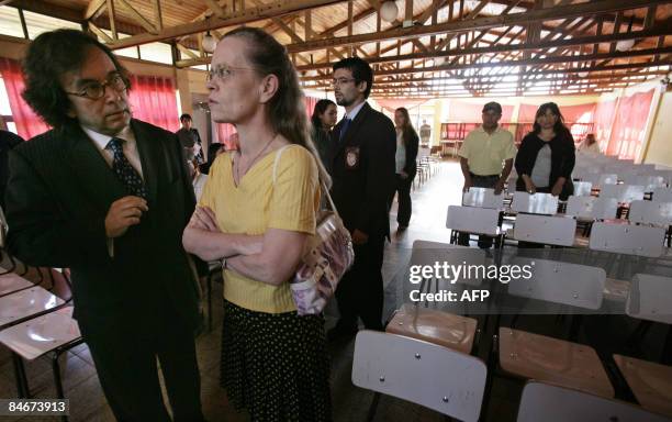 Judge Sylvie Gagnard , of the financial section of Paris court, listens to a Chilean lawyer before a hearing with victims of the fraud known as...