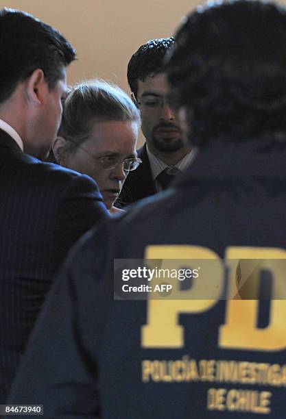 Judge Sylvie Gagnard , of the financial section of Paris court, is surrounded by police officers before a hearing with victims of the fraud known as...