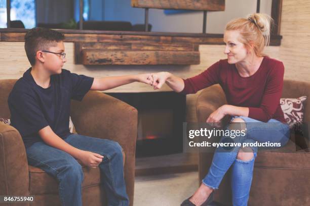 foster care woman and boy child talking - foster care stock pictures, royalty-free photos & images