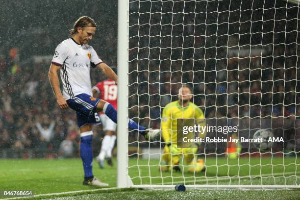 Michael Lang of FC Basel reacts after conceding a goal to make it 3-0 during the UEFA Champions League match between Manchester United and FC Basel...