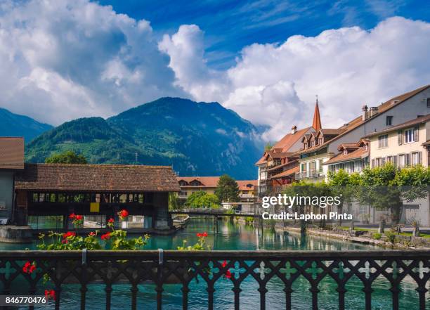 interlaken little town with thun-river - interlaken stock-fotos und bilder