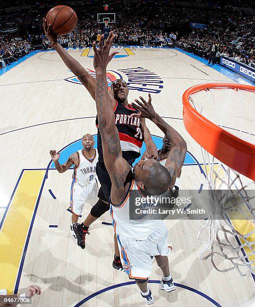 Travis Outlaw of the Portland Trail Blazers goes to the basket against Joe Smith of the Oklahoma City Thunder at the Ford Center on February 6, 2009...