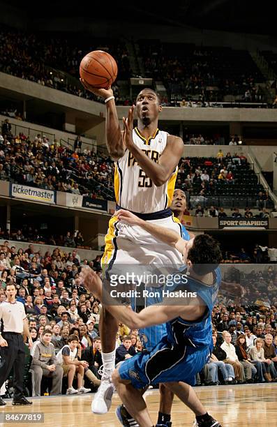 Roy Hibbert of the Indiana Pacers lays the ball up over J.J. Redick of the Orlando Magic at Conseco Fieldhouse on February 6, 2009 in Indianapolis,...