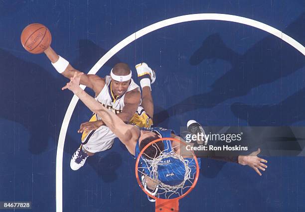 Ford of the Indiana Pacers shoots over Hedo Turkoglu of the Orlando Magic at Conseco Fieldhouse on February 6, 2009 in Indianapolis, Indiana. The...