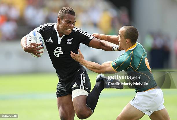 Lote Raikabula of New Zealand fends off Paul Delport of South Africa during the match between New Zealand and South Africa on day two of the New...