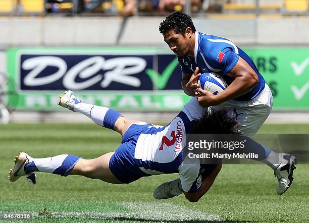 Alafoti Fa'osiliva of Samoa is tackled by Thomas Combezou of France during the match between France and Samoa on day two of the New Zealand...