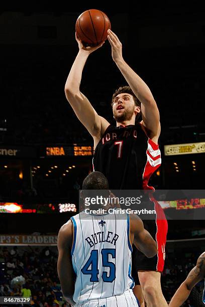 Andrea Bargnani of the Toronto Raptors makes a shot over Rasual Butler of the New Orleans Hornets on February 6, 2009 in New Orleans, Louisiana. The...