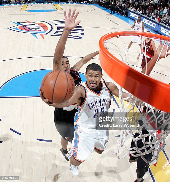 Earl Watson of the Oklahoma City Thunder goes to the basket against LaMarcus Aldridge of the Portland Trail Blazers at the Ford Center on February 6,...