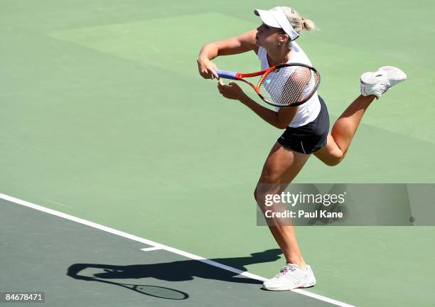 Dianne Hollands of New Zealand serves to Jelena Dokic of Australia during day four of the Fed Cup Asia/Oceania Zone Group 1 & 2 match between...