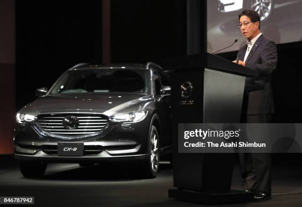 Mazda Motor Co President Masamichi Kogai introduces new SUV 'CX-8' during its unveiling on September 14, 2017 in Tokyo, Japan.