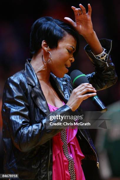 Singer Michelle Williams sings the national anthem during the game between the Boston Celtics and the New York Knicks at Madison Square Garden...