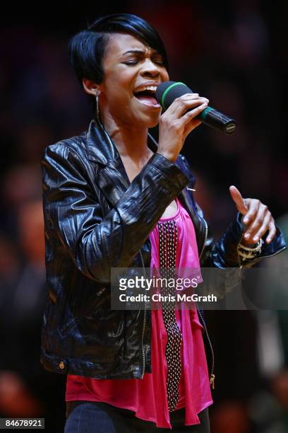 Singer Michelle Williams sings the national anthem during the game between the Boston Celtics and the New York Knicks at Madison Square Garden...