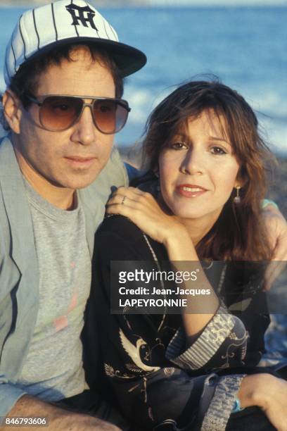 Close up Paul Simon et Carrie Fisher le 20 septembre 1983 en France.