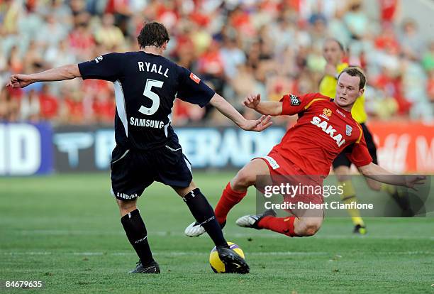 Kristian Sarkies of United tackles Sebastian Ryall of the Victory during the A-League major semi final first leg match between Adelaide United and...