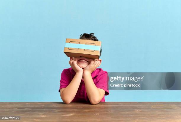 child is discovering the virtual reality glasses - cardboard vr stock pictures, royalty-free photos & images