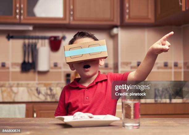 child is discovering the virtual reality glasses - surreality stock pictures, royalty-free photos & images