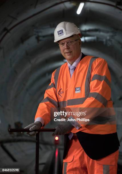 Transport Secretary Chris Grayling secures the final clips on the Elizabeth Line track as the Crossrail project celebrates the completion of the...