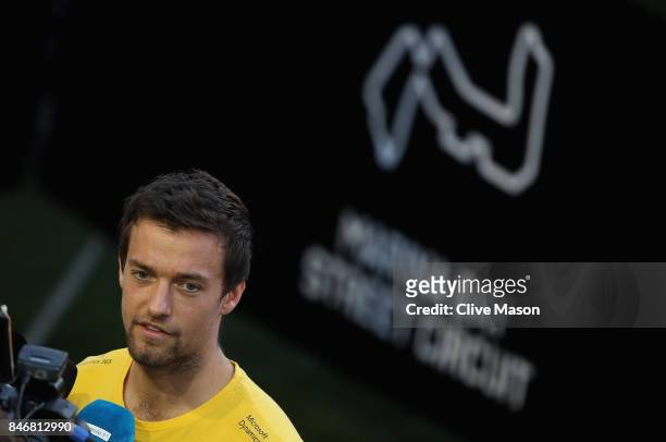 Jolyon Palmer of Great Britain and Renault Sport F1 talks to the media in the Paddock during previews ahead of the Formula One Grand Prix of...