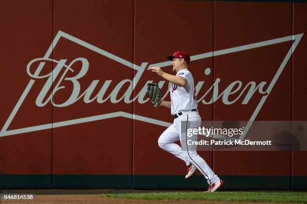 Adam Lind of the Washington Nationals catchs a fly ball hit by Kurt Suzuki of the Atlanta Braves in the third inning at Nationals Park on September...