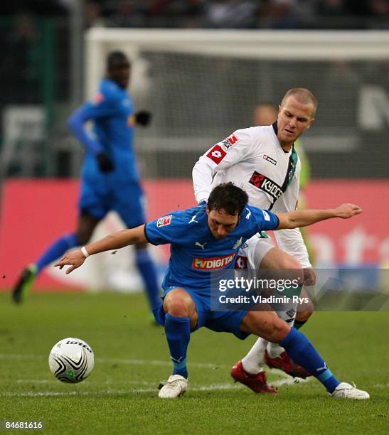 Tobias Weis of Hoffenheim and Michael Bradley of Gladbach battle for the ball during the Bundesliga match between Borussia Moenchengladbach and 1899...