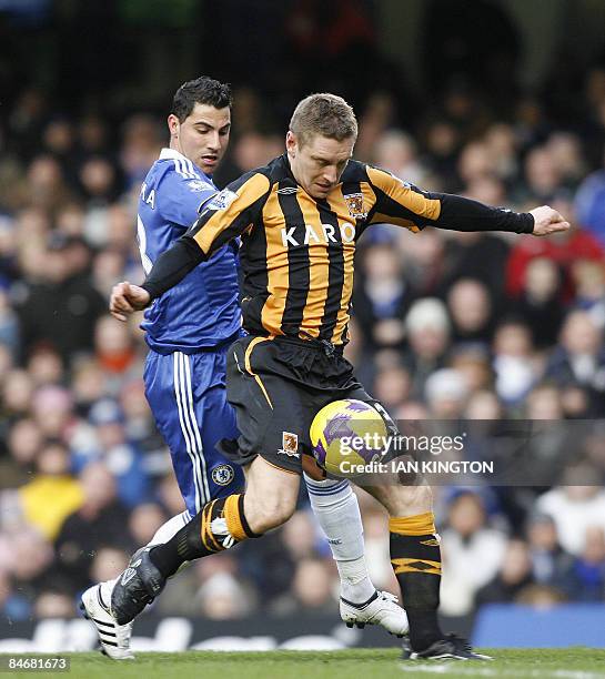 Hull City's Andy Dawson is challenged by Chelsea's Portugese player Ricardo Quaresma during their Premier League football match at Stamford Bridge in...